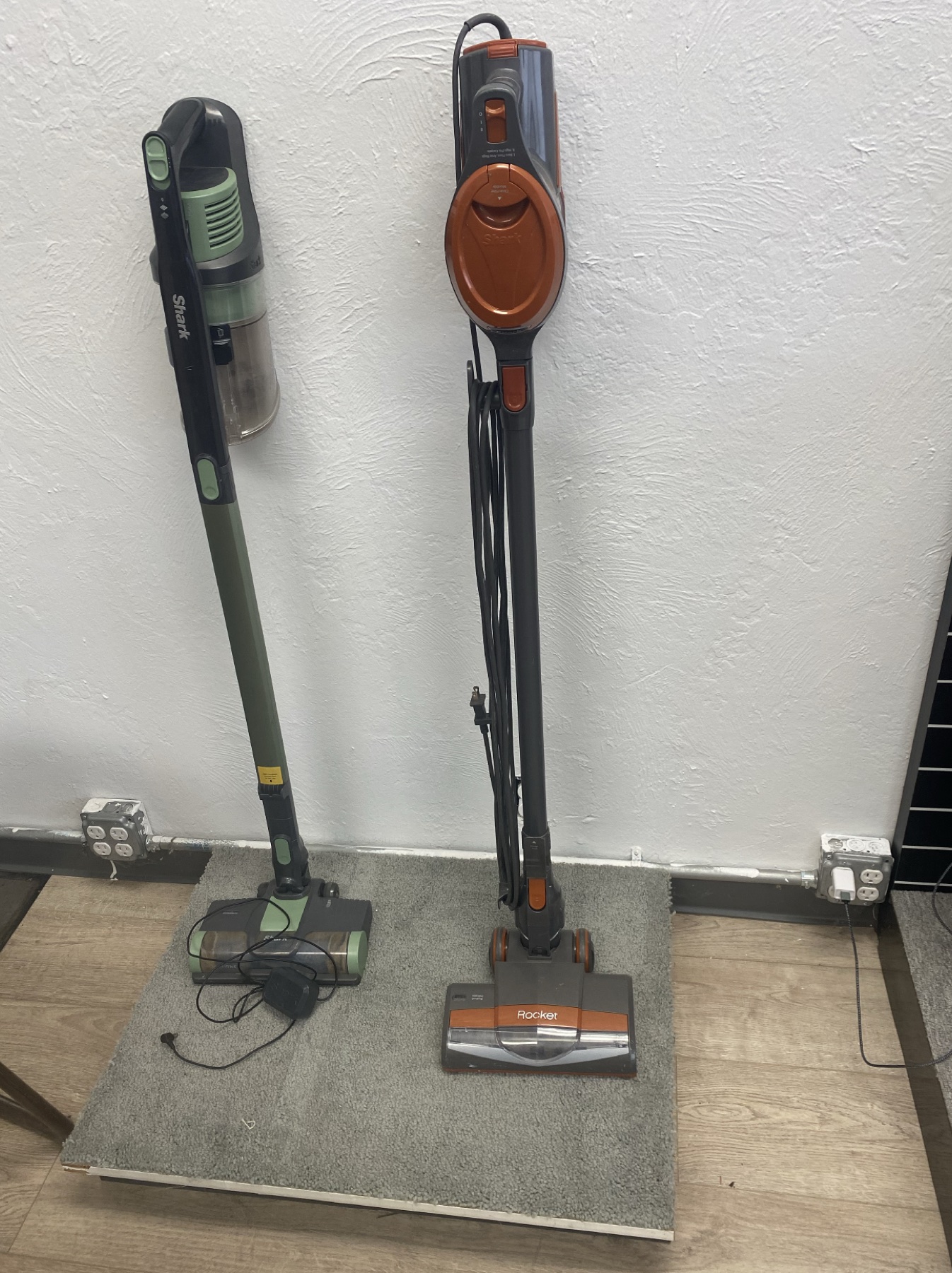 Shark cordless and Rocket upright vacuums displayed at Skaggs Vacuums